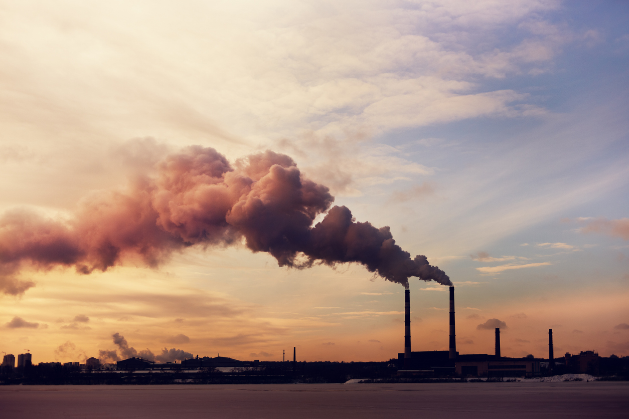 Zeigo Activate: New Sustainability Tools and Features | Zeigo Sustainability Software Smoke stacks of smoke and smoke coming out of a factory zeigo | sustainability software solution